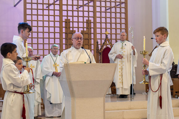 Deacon Frank McKevitt proclalms the Gospel.