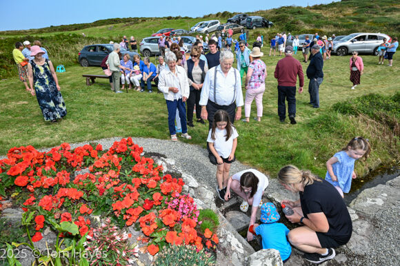 Gathering water from the well after the Mass at Our Lady's Well, Ardfield/Rathbarry Parish for the Feast of the Assumption of Our Lady.
